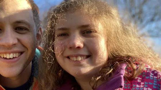 Father and daughter smile to camera