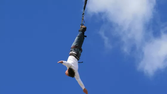 Man doing charity bungee jump 