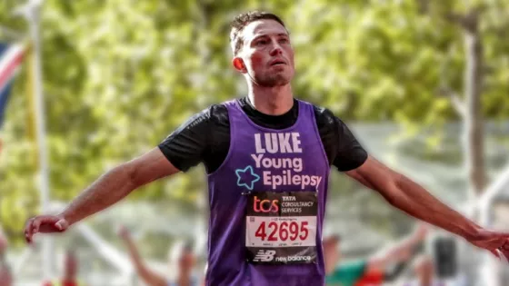 Man running with arms outstretched