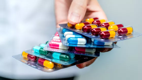 Photo of a healthcare professional holding medication