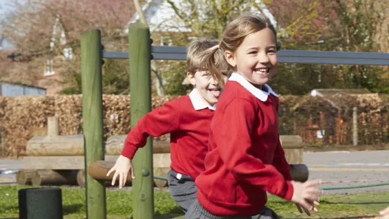 A photo of school children playing outside