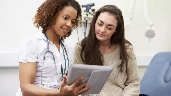 teenager talking to a doctor