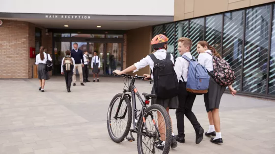 kids going to school on a bike