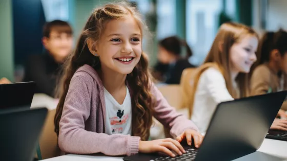 young girl on her laptop to show healthy connections via an online youth club