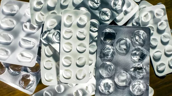 Empty pill packets represent epilepsy medication shortages.