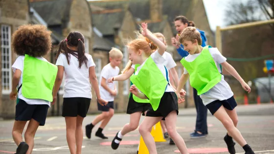 children doing PE in the playground