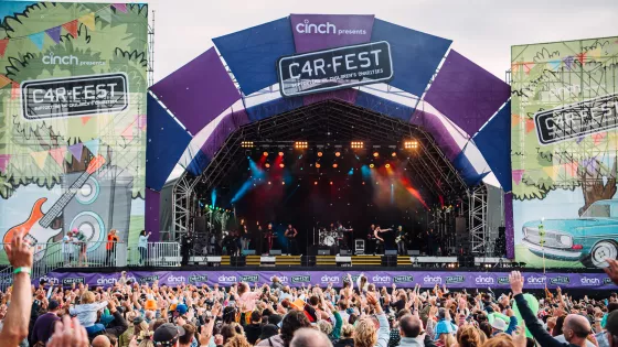 Carfest stage with crowds of people