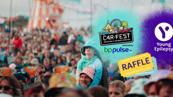 Carfest crowd of people with child on his dads shoulders