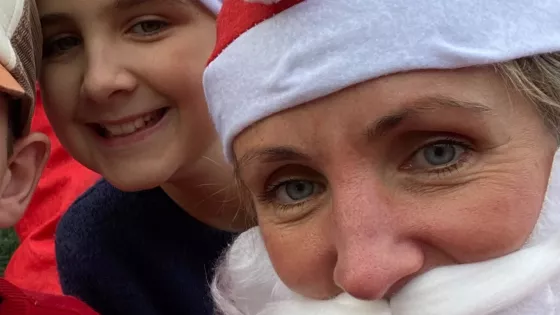 Family pose in Santa costumes