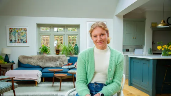 girl sat in the kitchen
