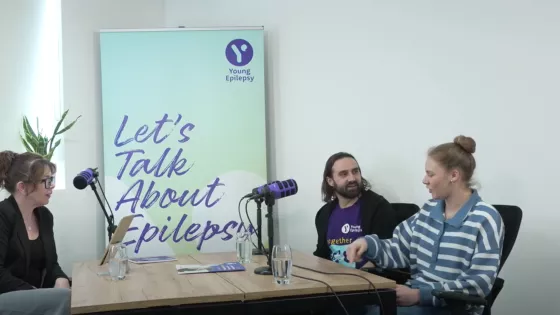 Young girl and Youth Support worker sat at a desk for a podcast