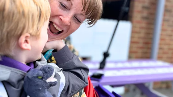 A parent and son having fun and laughing together