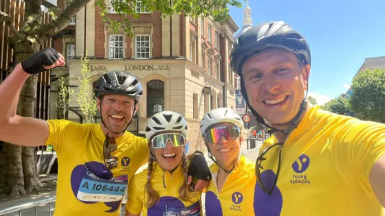 Group of smiling cyclist posing for a photo