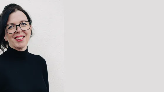 Epilepsy specialist nurse Kirsten smiles against a white background.