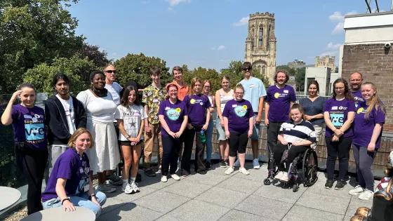 A group of young people with epilepsy gather on a rooftop.