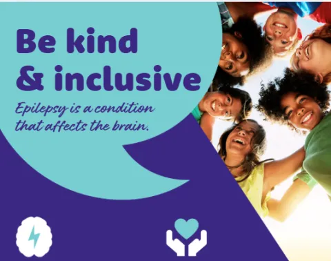 A slide from a school assembly says 'be kind and inclusive'.