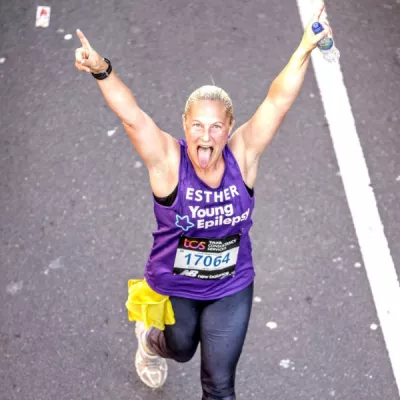 Women running with arms raised