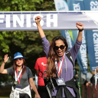 Women cheering under finish arch