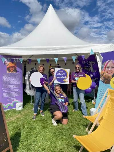 Ye staff at festival stand