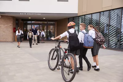 kids going to school on a bike