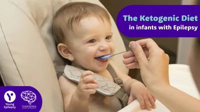 A baby being fed with a small spoon