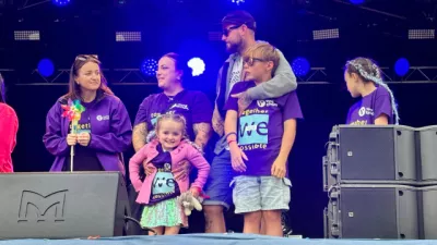 Young Epilepsy Ambassadors on stage at CarFest