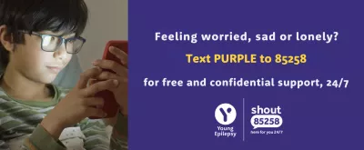 A banner promoting a 24/7 text support line