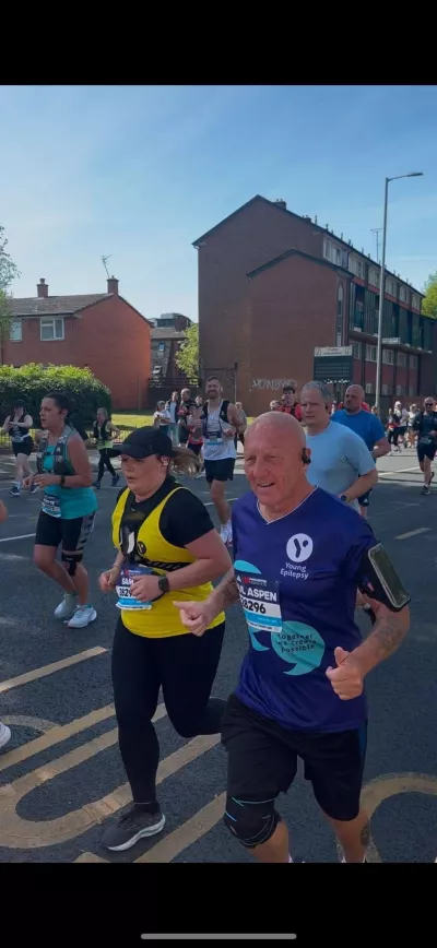 Two people representing Young Epilepsy run in the Manchester Marathon.