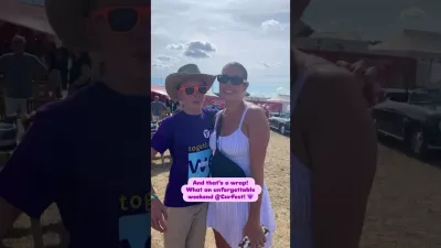 Two women smile at CarFest 2025.