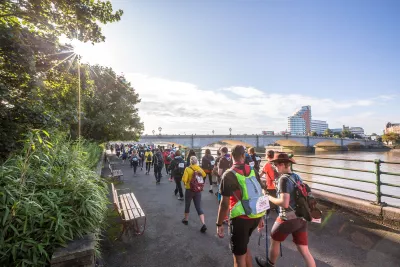 Walkers along the Thames in London
