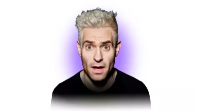 Simon Brodkin looks intensely at camera on a purple and white background.