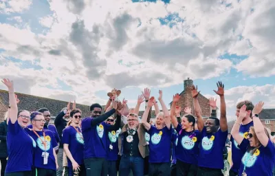 A group of Young Epilepsy supporters cheer at the end of a challenge event.