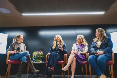 Four women sit on a panel at the Hear Her Voice event.