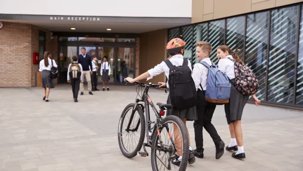kids going to school on a bike