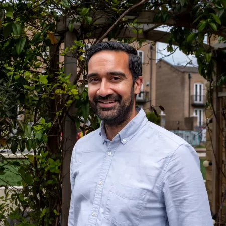 Profile photograph of Amit Bali taken outside in a garden