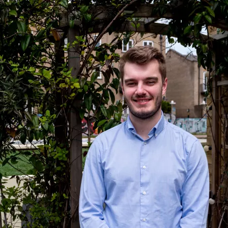 Profile photograph of Joe, a Young Rep and Young Trustee taken outside in a garden