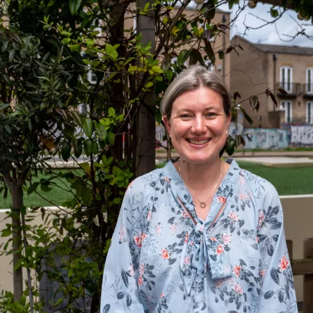 Profile photograph of Professor Katie Stevens taken outside in a garden
