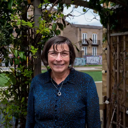 Profile photograph of Professor Helen Cross taken outside in a garden