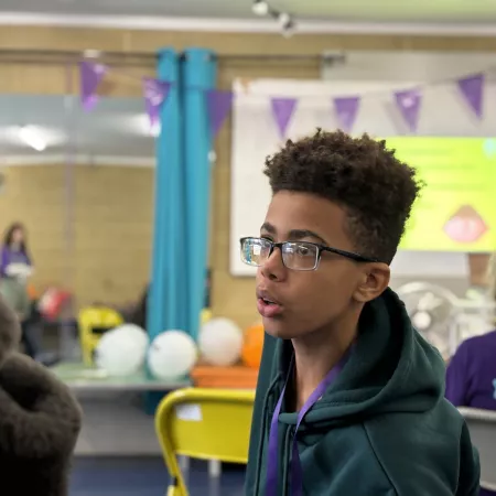 A young boy looking away from the camera