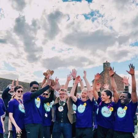 A group of Young Epilepsy supporters cheer at the end of a challenge event.