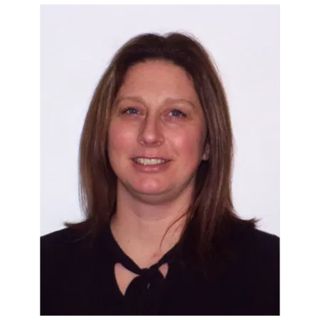 woman with long brunette hair in a black top