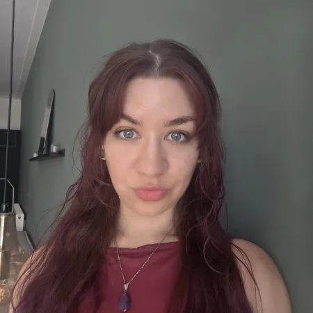 A young woman poses in a selfie.