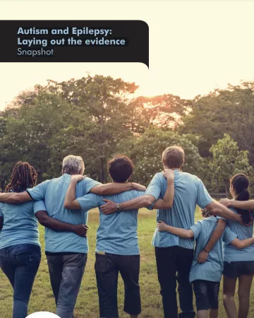 A row of people in matching blue t-shirts hold shoulders facing the sunset on the Autism and Epilepsy snapshot cover.