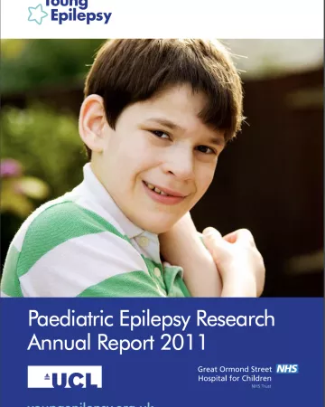 A boy smiles on the Research Report 2011 cover.
