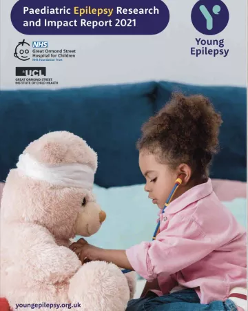 A toddler plays doctor with a stuffed animal on the Research Report 2021 cover.