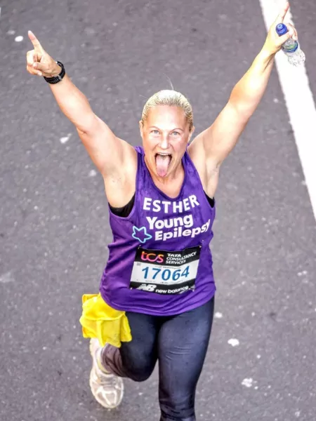 Women running with arms raised