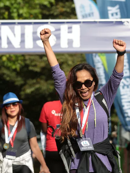 Women cheering under finish arch