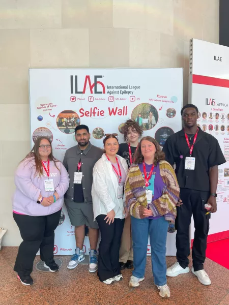 young reps in front of the selfie wall