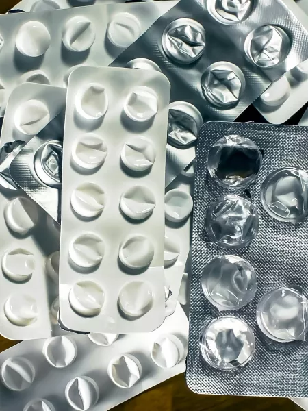 Empty pill packets represent epilepsy medication shortages.