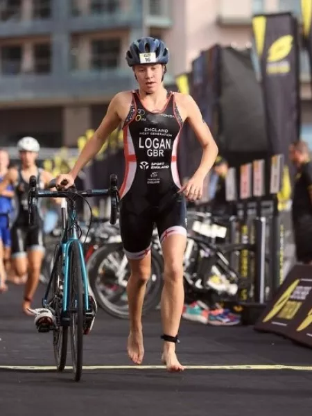 Olivia finishes a triathlon